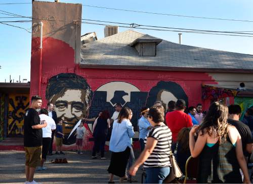Scott Sommerdorf   |  The Salt Lake Tribune
The scene outside the Azteca De Oro Taqueria restaurant, Thursday, July 23, 2015. About two hundred people came to support the mural of Cesar Chavez and Dolores Huerta on the north side of the building.