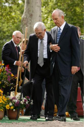 Leah Hogsten  |  The Salt Lake Tribune
President Boyd K. Packer, left, gets a hand walking from Elder Russell M. Nelson, right, during the groundbreaking for a new LDS temple in Brigham City, Utah, on July 31, 2010.