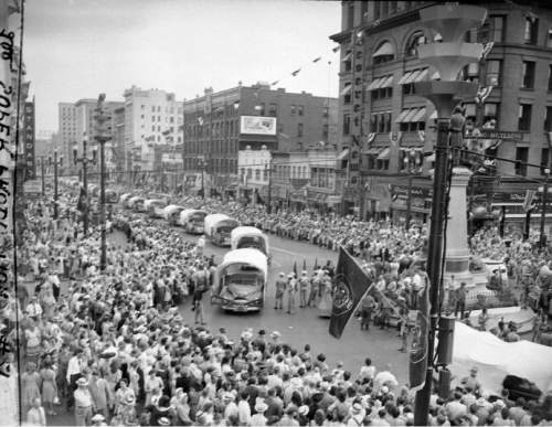 |  Salt Lake Tribune file photo

Huge crowds gather to watch the Days of '47 Parade on July 24, 1947, as cars decorated like covered wagons make their way along Main Street.