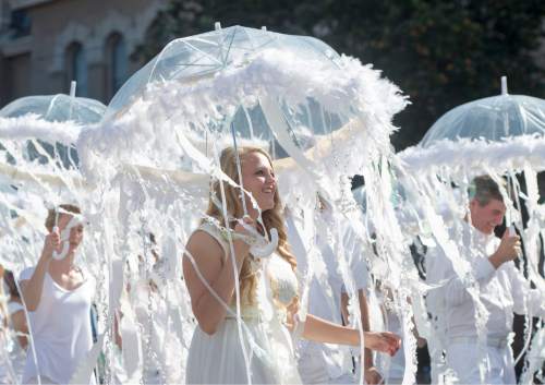 Rick Egan  |  The Salt Lake Tribune

Emma Barlow walks as a jellyfish, with The Riverton Utah Central Stake float, "forging friendships across the Seas" in Days of '47 parade, Friday, July 24, 2015.