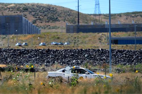 Scott Sommerdorf   |  The Salt Lake Tribune
A UHP trooper sits at the entrance to the Utah Data Center last week.