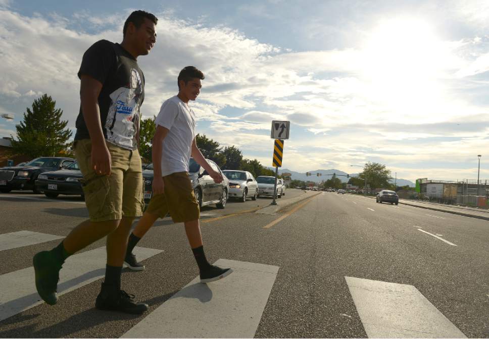 Leah Hogsten  |  The Salt Lake Tribune
l-r Hugo Alfaro and Abad Pastrana say when they attend Taylorsville High School next year they will probably be crossing the busiest intersection in Utah twice a day to attend school. With 99,915 cars a day on average, the busiest intersection in Utah is 5400 South and Redwood Road,  July 16, 2015.