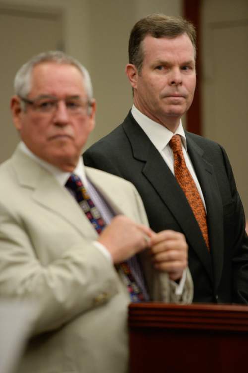 Francisco Kjolseth | The Salt Lake Tribune
Former Utah Attorney General John Swallow, right,  appears at the Matheson Courthouse in Salt Lake City on Monday, July, 27, 2015, alongside his attorney Steve McCaughey for an arraignment hearing. Swallow had his attorney plead not guilty on his behalf to more than a dozen criminal charges of corruption.