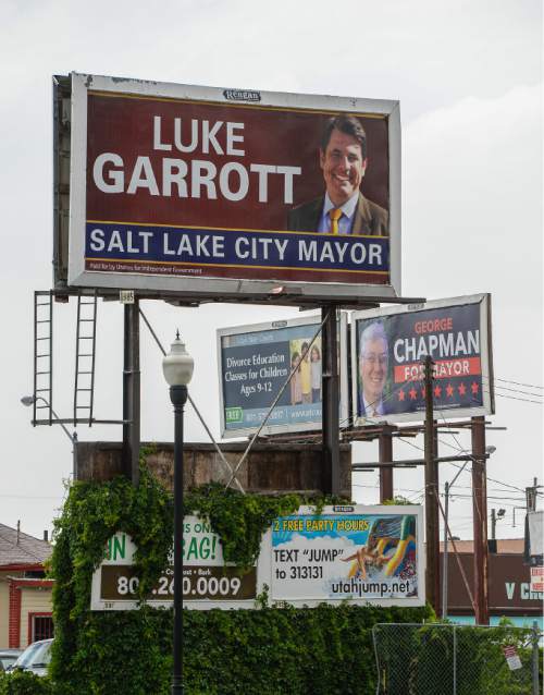 Francisco Kjolseth | The Salt Lake Tribune
A political action committee formed by Reagan Outdoor Advertising is putting up billboards of opponents to Mayor Ralph Becker. First they put them up for Jackie Biskupski. Now they're putting them up for Luke Garrott, George Chapman and Dave Robinson. On 900 South between State and Main billboards for Luke Garrott and George Chapman can be seen close together.