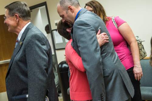 Chris Detrick  |  The Salt Lake Tribune
Kathy Wride hugs Deputy Greg Sherwood after the sentencing of Meagan Grunwald at 4th District Court in Provo Wednesday July 8, 2015.  Eighteen-year-old Meagan Grunwald was sentenced Wednesday to 25 years to life in prison for being an accomplice to the murder last year of Utah County Sheriff's Sgt. Cory Wride and the attempted murder of Deputy Greg Sherwood.