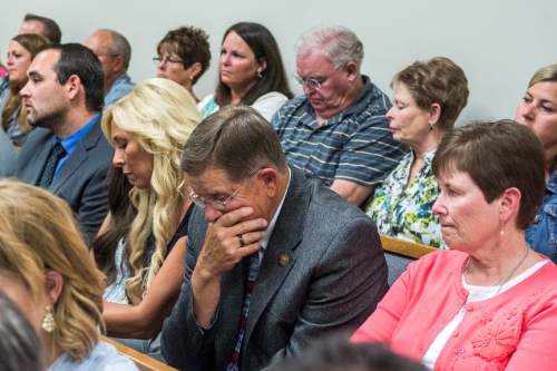 Chris Detrick  |  The Salt Lake Tribune
Nathan Moeller, Nannette Wride, Blake Wride and Kathy Wride listen during the sentencing of Meagan Grunwald at 4th District Court in Provo Wednesday July 8, 2015.  Eighteen-year-old Meagan Grunwald was sentenced Wednesday to 25 years to life in prison for being an accomplice to the murder last year of Utah County Sheriff's Sgt. Cory Wride and the attempted murder of Deputy Greg Sherwood.