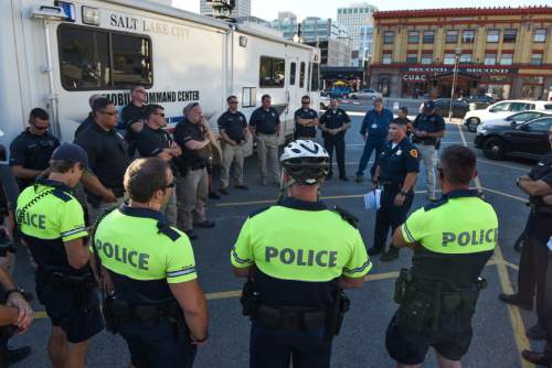 Francisco Kjolseth | The Salt Lake Tribune
Lt. Tyrone Farillas, center right,  with the Salt Lake Police Department briefs officers working the graveyard shift before their patrol of the parade route on Thursday evening, July 23, 2015.