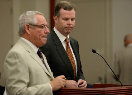 Francisco Kjolseth | The Salt Lake Tribune
Former Utah Attorney General John Swallow, right,  appears at the Matheson Courthouse in Salt Lake City on Monday, July, 27, 2015, alongside his attorney Steve McCaughey for an arraignment hearing. Swallow had his attorney plead not guilty on his behalf to more than a dozen criminal charges of corruption.