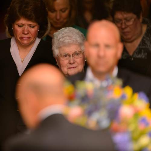 Trent Nelson  |  The Salt Lake Tribune
Donna Packer and family members look on as her husband, LDS apostle Boyd K. Packer's casket is taken from the Tabernacle following his funeral in Salt Lake City, Friday July 10, 2015.