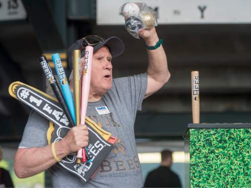 Rick Egan  |  The Salt Lake Tribune

Paul Watson sells souvenir bats, baseballs, and foam fingers, at the Salt Lake Bees game, Wednesday, May 27, 2015. Watson has selling programs, souvenirs, and peanuts at sporting events for 27 years.