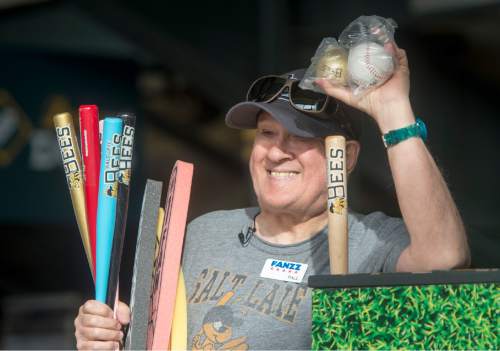 Rick Egan  |  The Salt Lake Tribune

Paul Watson sells souvenir bats, baseballs, and foam fingers, at the Salt Lake Bees game, Wednesday, May 27, 2015. Watson has selling programs, souvenirs, and peanuts at sporting events for 27 years.