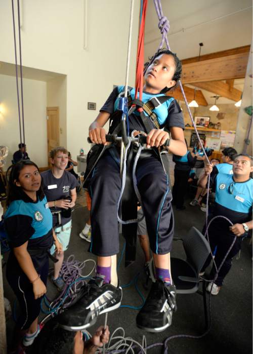 AAl Hartmann  |  The Salt Lake Tribune
Andrea Guadalupe, 12, from El Salvador uses a safety harness and 4 to 1 pully system to ascend a rope at the National Abilty Center in Park City using just her arms.    She has Spina Bifida and has no use of her legs.   A group of instructors from El Salvador have been trained to work with youth from their country as part of the SportsUnited program.