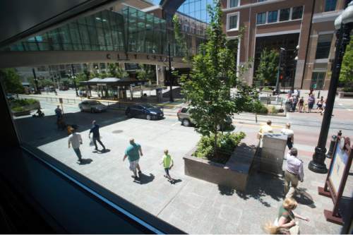 Steve Griffin  |  The Salt Lake Tribune


Pedestrians make their way along Main Street between 100 south and West Temple in Salt Lake City, Friday, July 31, 2015.  A University of Utah study of downtown Salt Lake City, block by block, shows that pedestrian traffic is significantly boosted by engaging urban design, such as windows overlooking sidewalks, uniform building setback, courtyards, outdoor dining and unique details that give buildings character.