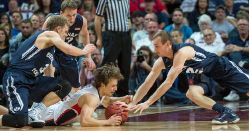 Rick Egan  |  The Salt Lake Tribune

Brigham Young Cougars guard Tyler Haws (3) goes for a loose ball, along with forward Josh Sharp (12), and Gonzaga Bulldogs guard Kevin Pangos (4) in the West Coast Conference championship game, BYU vs. Gonzaga, at the Orleans Arena, in Las Vegas, Tuesday, March 10, 2015