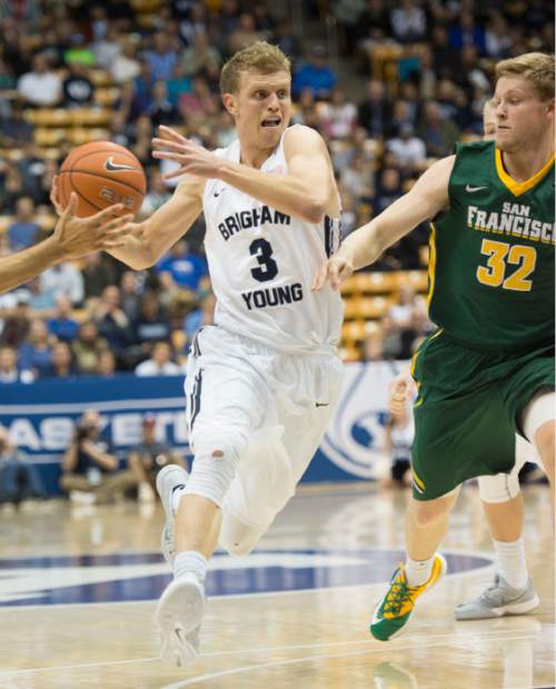 Steve Griffin  |  The Salt Lake Tribune

BYU's Tyler Haws drives on San Francisco's Tim Derksen during first half action in there game at the Marriott Center in Prove, Utah Thursday, January 29, 2015.