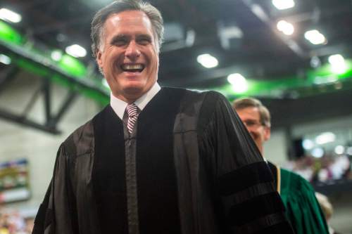 Chris Detrick  |  The Salt Lake Tribune
Mitt Romney smiles as he walks during Utah Valley University's Commencement Ceremonies at the UCCU Events Center Thursday April 30, 2015.
