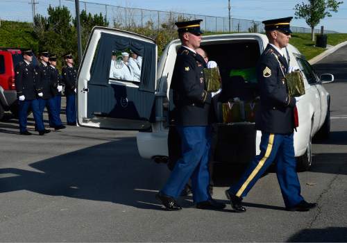 Scott Sommerdorf   |  The Salt Lake Tribune
Two members of an Army honor guard carry the remains of two Army veterans who were among the 22 whose remains have never been claimed. They were interred in a service at the state veterans cemetery in Bluffdale, Saturday, August 1, 2015.