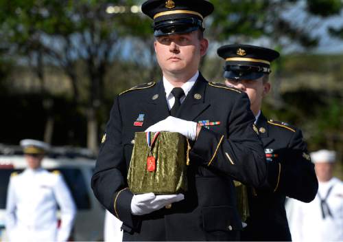 Scott Sommerdorf   |  The Salt Lake Tribune
Two members of an Army honor guard carry the remains of two Army veterans who were among the 22 whose remains have never been claimed. They were interred in a service at the state veterans cemetery in Bluffdale on Saturday.