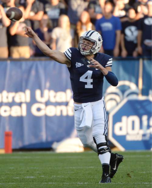 Steve Griffin  |  The Salt Lake Tribune


BYU Cougars quarterback Taysom Hill (4) fires a pass downfield during game between BYU and Houston and LaVell Edwards Stadium in Provo, Thursday, September 11, 2014.