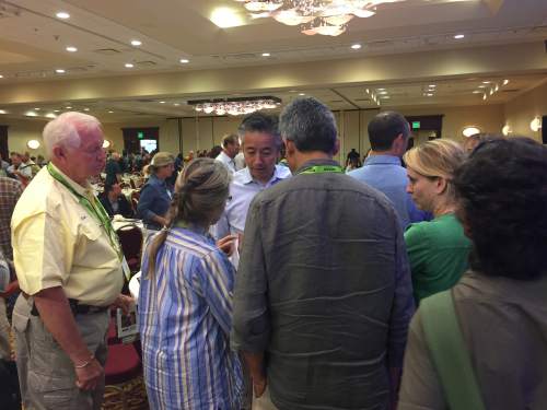 Benjamin Wood  |  The Salt Lake Tribune
Norbu Tenzing, Vice President of the American Himalayan Foundation, greets visitors at the Outdoor Industry Association Industry Breakfast, which kicked off the 2015 Outdoor Retailer Summer Market on Wednesday.