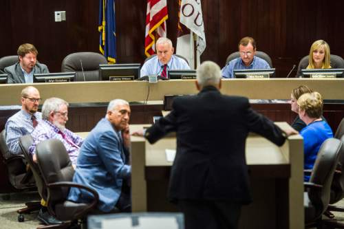 Chris Detrick  |  The Salt Lake Tribune
Members of the Salt Lake County Council listen as Utah Transit Authority Board of Trustees Chairman H. David Burton speaks during public comment at the Salt Lake County Government Center Tuesday August 4, 2015.
