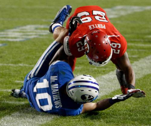 Trent Nelson  |  The Salt Lake Tribune
Utah Utes defensive back Reginald Porter (29) shoves Brigham Young Cougars wide receiver Mitch Mathews (10) to the ground on the final play as the BYU Cougars host the Utah Utes, college football Saturday, September 21, 2013 at LaVell Edwards Stadium in Provo.