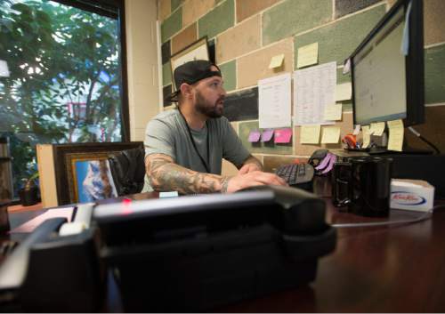 Steve Griffin  |  The Salt Lake Tribune

Housing specialist, Jason Geeck, works on finding housing for his clients at the Road Home in Salt Lake City Thursday, August 6, 2015.