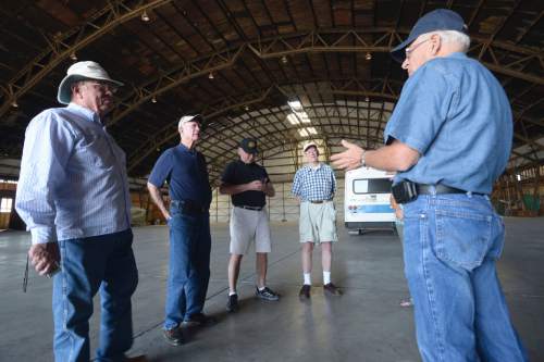 Al Hartmann  |  The Salt Lake Tribune
(L to R)  Bill Coyne, from Gulf Shores, Ala.; George Uthlaut, of Houston; and Craig Cooper and Ralph Gates of Park City take a historical tour inside the "Enola Gay" hangar at Wendover Airfield as Jim Petersen, right, president of the Historic Wendover Airfield Foundation, answers questions. 
The Enola Gay, piloted by Col. Paul Tibbets, dropped the first atomic bomb on Hiroshima, Japan, on Aug. 6, 1945. Three days later, the bomb Fat Man was dropped on Nagasaki. The long-disance bombers trained at Wendover Airfield. The bombings brought a swift end to war with Japan, but it was only later that the people of Wendover realized that their air base had housed the U.S. Army Air Force group that dropped the bomb, the 509th Composite Group. Tibbets was commander of the group that trained at Wendover and practiced with test bombs on the surrounding ranges.