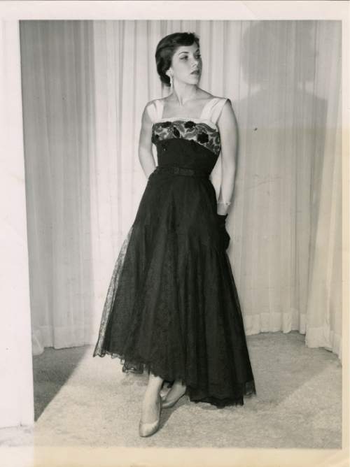 Salt Lake Tribune file photo

The original caption on this 1950 photo says: "Hattie Carnegie offersin her fall collectiona hip-hugging black lace skirt ankle length in front and dipping to the floor in the back. The bodice is black lace over black taffata with yoke and wide straps of Carnegie blue satin. The skirt can be worn wih a variety of tops for more or less formal occasions."
