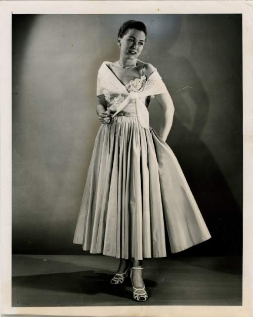 Salt Lake Tribune file photo

The original caption on this 1950 photo says: "This is Jo Copeland's champagne silk evening dress with a white lace embroidered organdie stole."