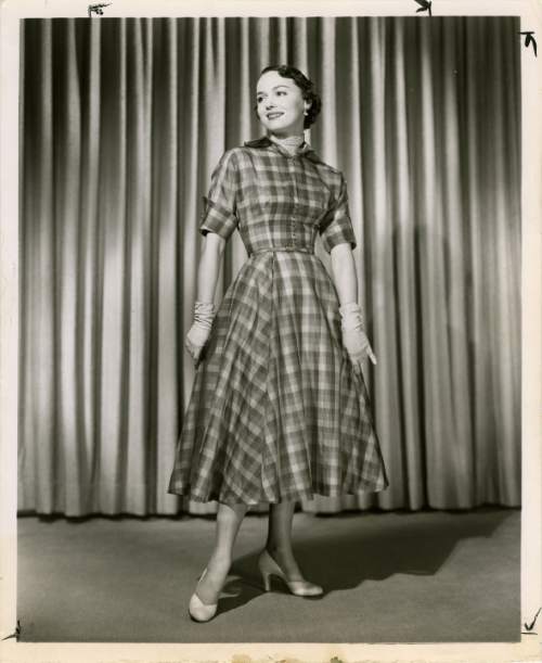 Salt Lake Tribune file photo

A model poses in a dress in this fashion photo from The Salt Lake Tribune archives. The photo is dated from 1950.