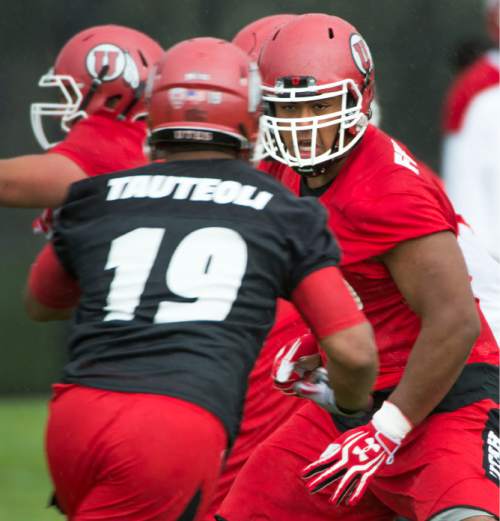 Steve Griffin  |  The Salt Lake Tribune


University of Utah offensive lineman Lo Falemaka looks to block linebacker Sunia Tauteoli (19) during second day of the teams fall camp at the University of Utah baseball field  in Salt Lake City, Friday, August 7, 2015.