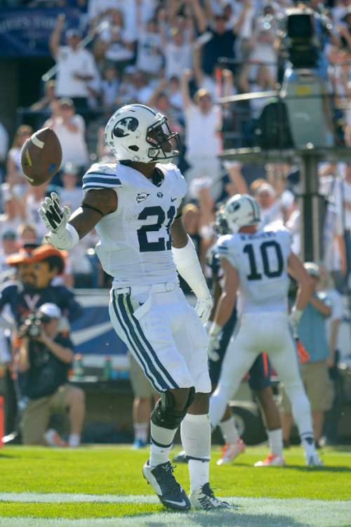 Chris Detrick  |  The Salt Lake Tribune
Brigham Young Cougars running back Jamaal Williams (21) celebrates his touchdown run during the second half of the game at LaVell Edwards Stadium Saturday September 20, 2014.  BYU won the game 41-33.