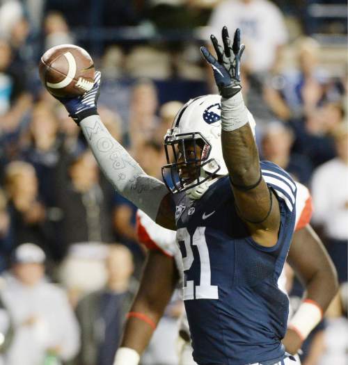 Steve Griffin  |  The Salt Lake Tribune


BYU Cougars running back Jamaal Williams (21) holds the football up after scoring a touchdown in the second half of the  game between BYU and Houston and LaVell Edwards Stadium in Provo, Thursday, September 11, 2014.
