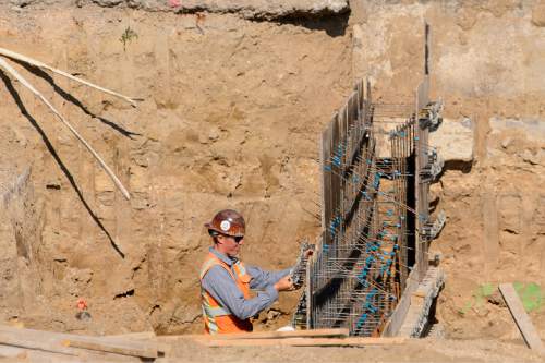 Trent Nelson  |  The Salt Lake Tribune
Workers from Phaze Concrete on the construction site of the new Rawlins High School in Rawlins, Wyoming, Tuesday June 30, 2015.