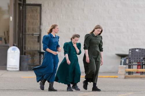 Trent Nelson  |  The Salt Lake Tribune
Three young women in fundamentalist prairie dresses in the parking lot of a retail store in Rawlins, Wyoming, Tuesday June 30, 2015.