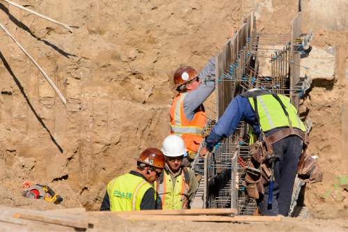 Trent Nelson  |  The Salt Lake Tribune
Workers from Phaze Concrete on the construction site of the new Rawlins High School in Rawlins, Wyoming, Tuesday June 30, 2015.