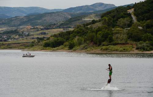 Francisco Kjolseth | The Salt Lake Tribune
Austin Kraus of Jay Peak, Vermont tries out Fly Boarding for the first time at Pineview Reservoir on Friday, Aug. 7, 2015. In Utah, 11 sources of drinking water have been known to develop toxic algal blooms from time to time, including Pineview. Dogs and animals are most at-risk because they don't know not to drink stagnant water.
