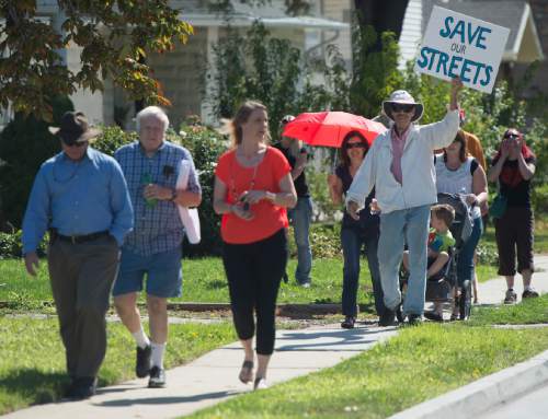 Rick Egan  |  The Salt Lake Tribune

South Salt Lake residents march to State Street to demonstrate their opposition to the noise, inconvenience and increased traffic caused by the closure of Burton and Truman Avenues, Saturday, Aug. 8, 2015.