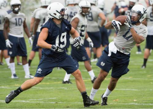 Steve Griffin  |  The Salt Lake Tribune

USU corner back Deshone Hines intercepts a pass intended for wide receiver Chasen Andersen during opening day of Utah State University football practice in Logan, Friday, August 7, 2015.  l