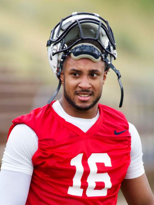 Steve Griffin  |  The Salt Lake Tribune

Utah State quarterback Chuckie Keeton listens to his coaches during opening day of football practice in Logan, Friday, August 7, 2015.  l