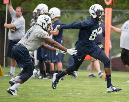 Steve Griffin  |  The Salt Lake Tribune

USU wide receiver Braelon Roberst zips past safety Marwin Evans during opening day of Utah State University football practice in Logan, Friday, August 7, 2015.  l