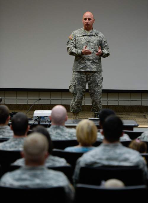 Francisco Kjolseth | The Salt Lake Tribune
Deputy Commander, 19th SFG COL James Slagowski speaks to the soldiers during the departure ceremony for 26 Soldiers of the Utah Army National Guard's 19th Special Forces (Airborne) on Monday, Aug. 10, at the Scott Lundell Readiness Center auditorium at Camp Williams. The mission of these Soldiers is to provide operational support to coalition forces involved in support of Operation Inherent Resolve in Afghanistan during a 12-month deployment.