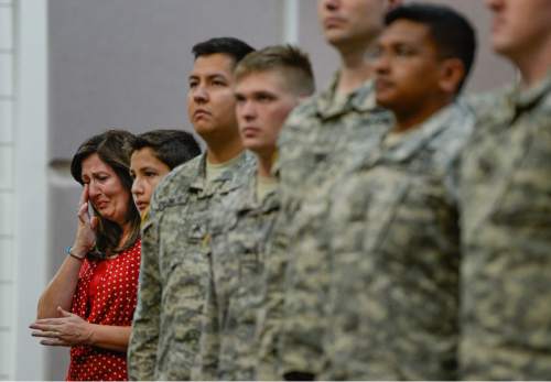 Francisco Kjolseth | The Salt Lake Tribune
Stephanie Chischillie, becomes emotional during the departure ceremony for 26 Soldiers of the Utah Army National Guard's 19th Special Forces (Airborne), which includes her son Sgt. Tyson Chischillie, standing next to her younger son Ryan, 13, on Monday, Aug. 10, at the Scott Lundell Readiness Center auditorium at Camp Williams. The mission of these Soldiers is to provide operational support to coalition forces involved in support of Operation Inherent Resolve in Afghanistan during a 12-month deployment.