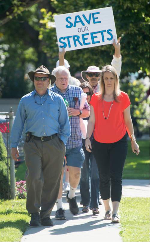 Rick Egan  |  The Salt Lake Tribune

South Salt Lake residents march to State Street to demonstrate their opposition to the noise, inconvenience and increased traffic caused by the closure of Burton and Truman Avenues, Saturday, Aug. 8, 2015.