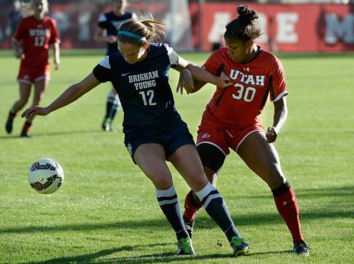 Scott Sommerdorf   |  The Salt Lake Tribune
Utah's Mariah Elmer deals with some physical play from BYU's Avery Calton. Utah's Katie Taylor scored on a second half penalty kick, and Utah women's soccer defeated BYU 1-0 in Salt Lake City, Friday, September 5, 2014.