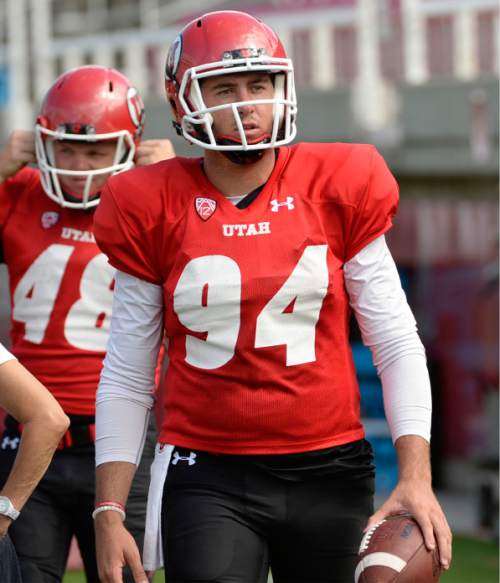 Al Hartmann  |  The Salt Lake Tribune 
Ute long snapper Chase Dominguez (No. 94), takes the field during scrimmage Wednesday August12.  Overlooked amid the attention given to Utah's kicker-punter combination (No. 39 Andy Phillips and No. 33 Tom Hackett), but those guys know they couldn't do it without him.