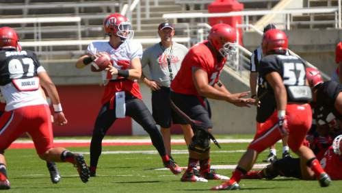 Leah Hogsten  |  The Salt Lake Tribune
Utah's head coach Kyle Whittingham is all smiles as back up quarterback Conner Manning looks to pass. University of Utah football team held its first fall scrimmage at Rice-Eccles Stadium, Thursday, August 13, 2015.