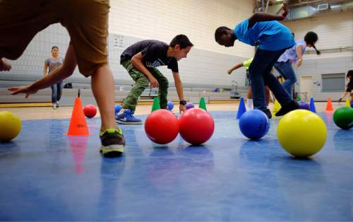 Trent Nelson  |  The Salt Lake Tribune
Children play dodgeball at the Sorenson Multicultural Center, Thursday August 13, 2015, as part Salt Lake City's YouthCity summer program.