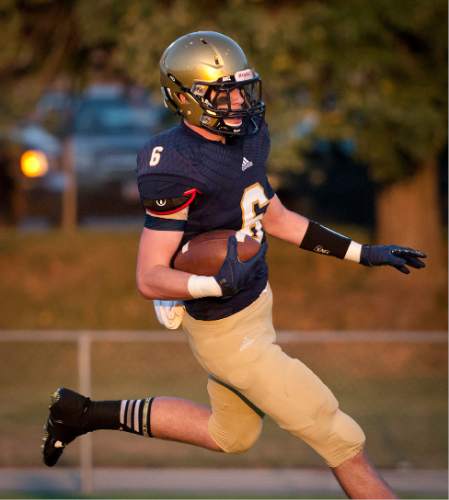 Michael Mangum  |  Special to The Salt Lake Tribune

Skyline junior tight end Riley Sharp runs in for a touchdown during the first half of their game against Murray at Skyline High School on Friday, September 19, 2014.